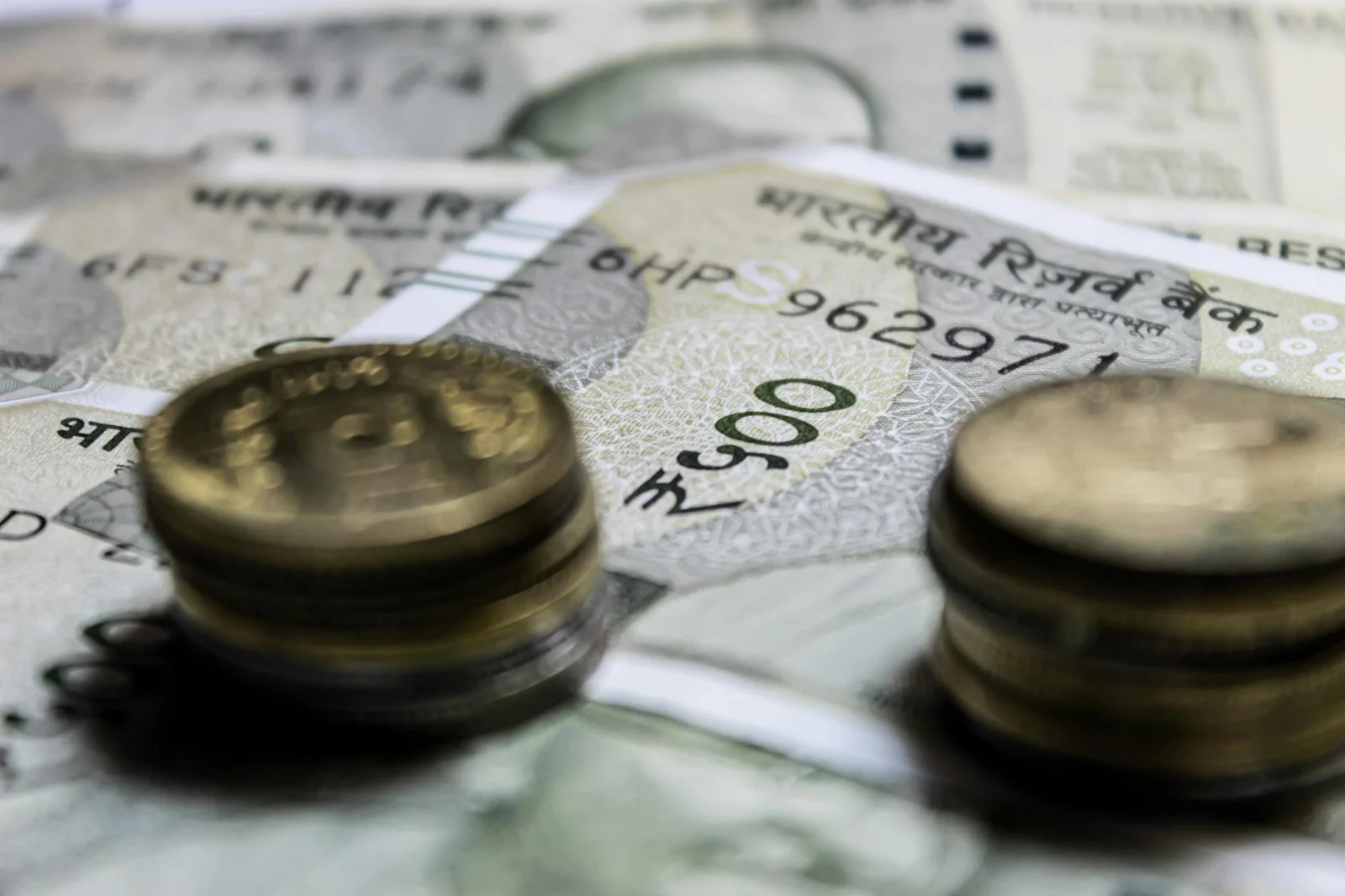 Fragmented Credit, Collective Discipline: The Legal - Detailed close-up of Indian rupee coins on top of banknotes, representi