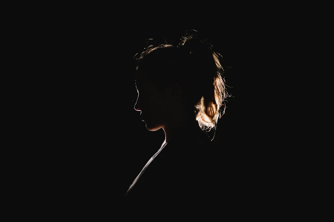 From Empowerment to Exploitation: Women in - A black silhouette of a woman