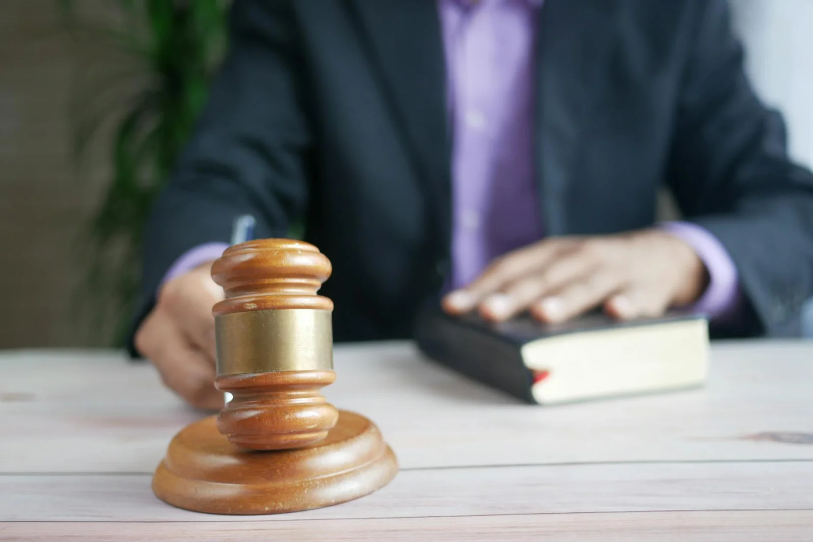 Judicial Scrutiny of Reserve Price in - A wooden gavel and legal book represent justice in a court setting, emphasizing order