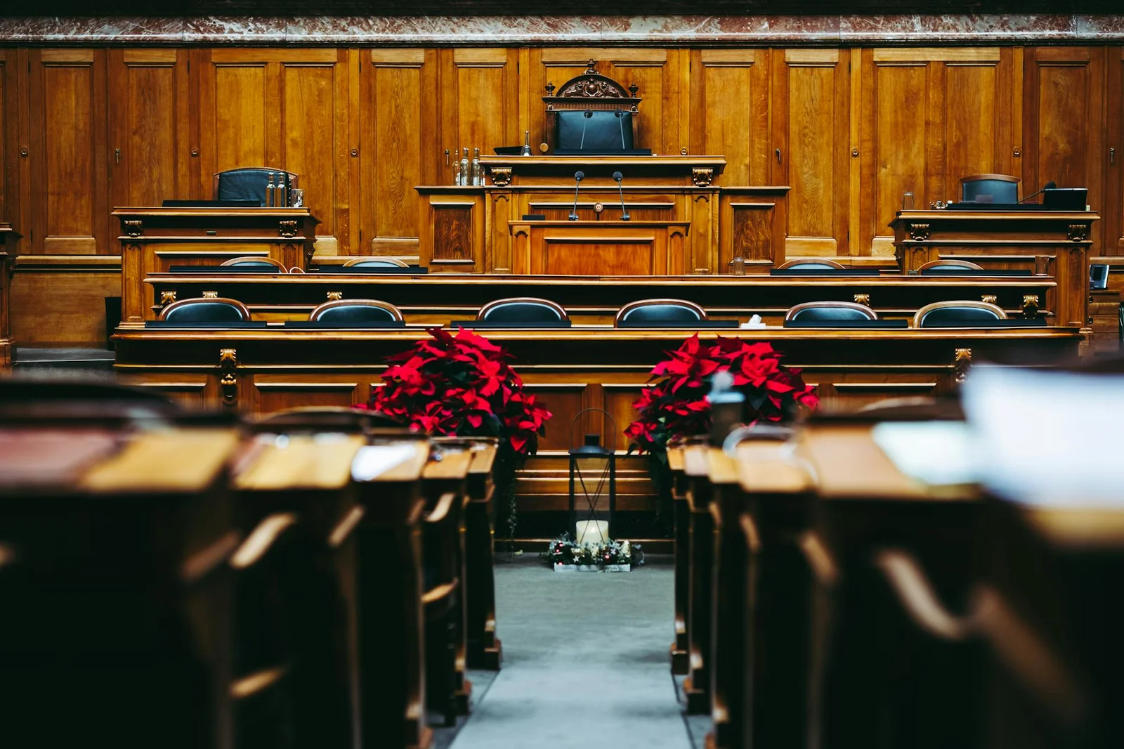 section 31 7 arbitration interest - - Spacious and elegant wooden courtroom with empty seats, located in Bern, Switzerland.
