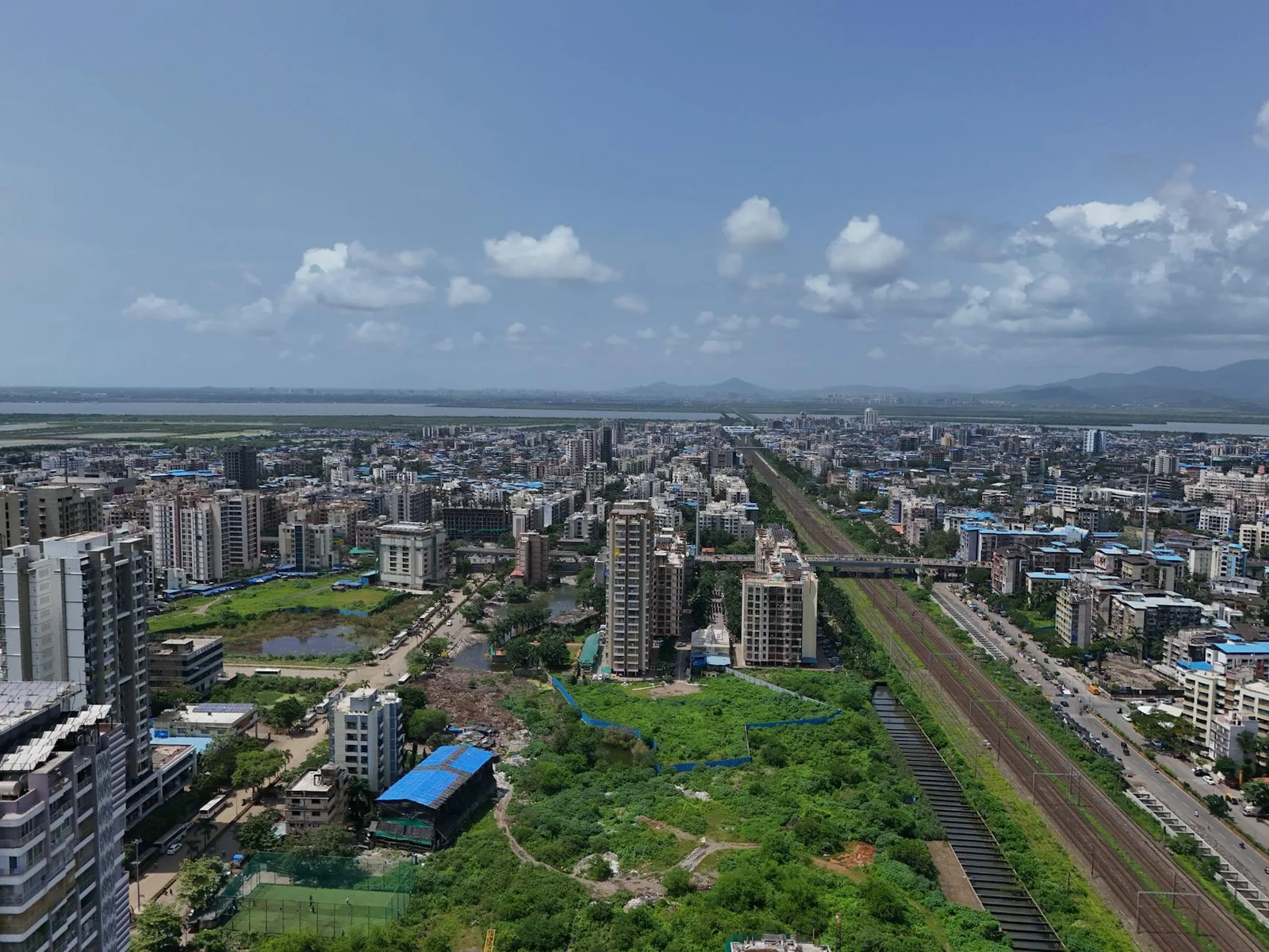 GIFT City IFSC financial ecosystem - - Stunning aerial shot of Mumbai's skyline, showcasing the bustling cityscape and vivid