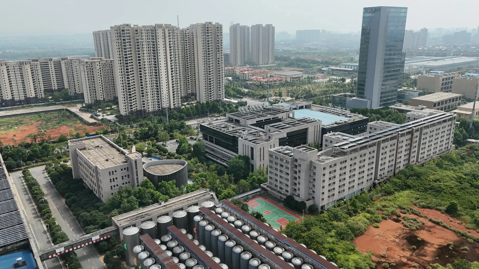 section 28a land acquisition act compensation - Aerial view showcasing urban architecture and greenery in Changsha, China.