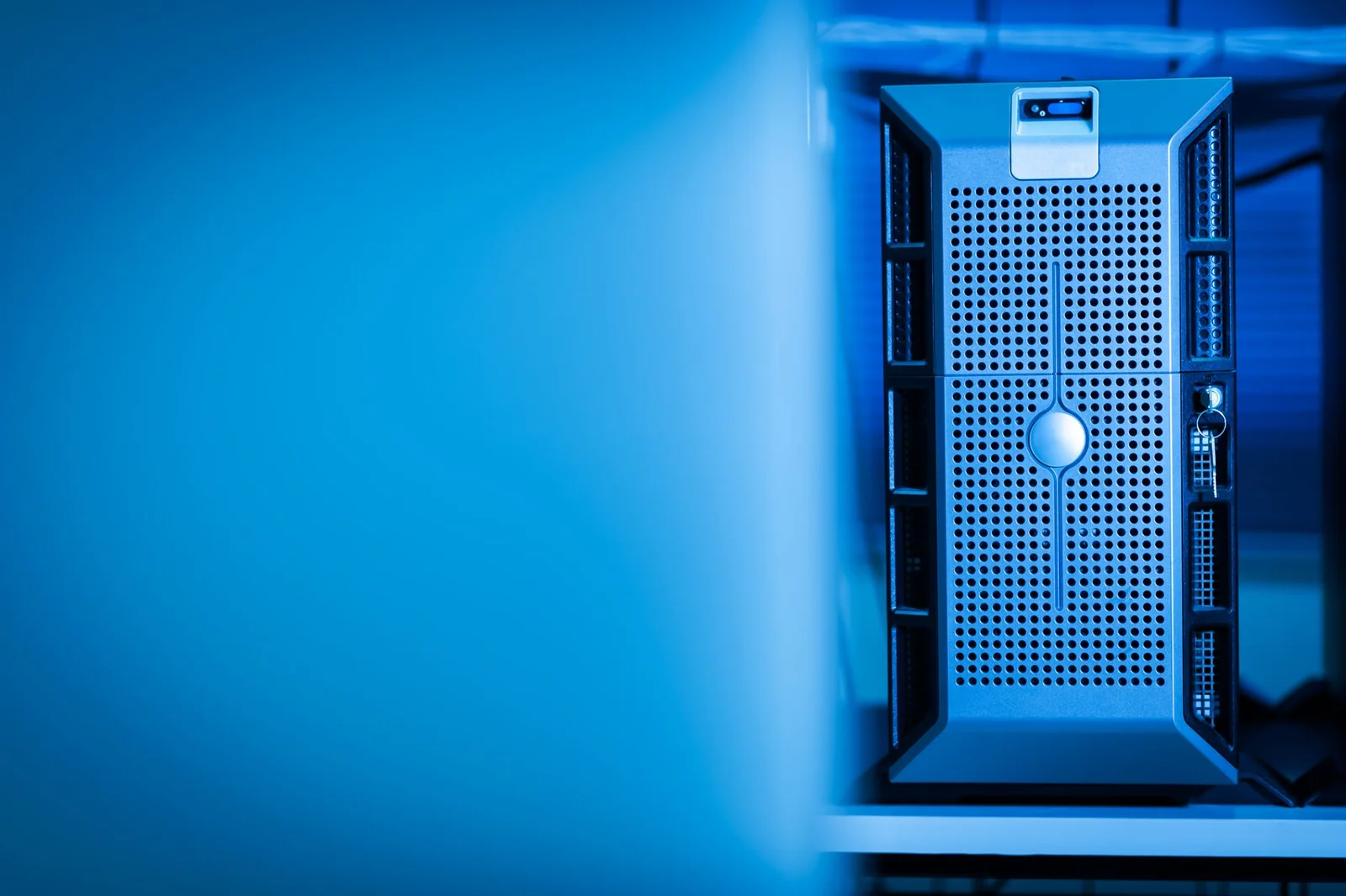 space-based data centers india - Beyond - Close-up of a modern server unit in a blue-lit data center environment.