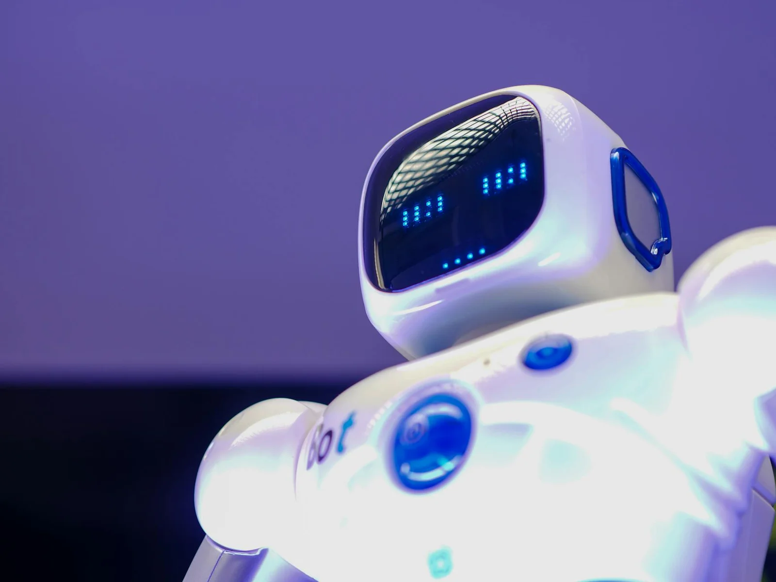 cyber operations artificial intelligence state responsibility - A modern humanoid robot with digital face and luminescent scr