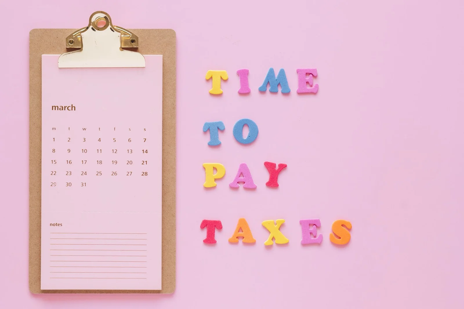 reassessment notices finance act 2026 supreme - Colorful tax reminder on clipboard against a pink background for March