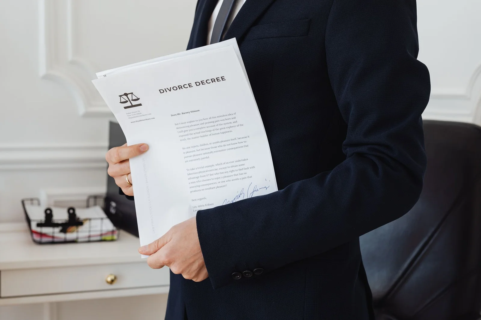 ibc limitation law resolution professional admission - A person holding a divorce decree in an office setting, symbolizing le