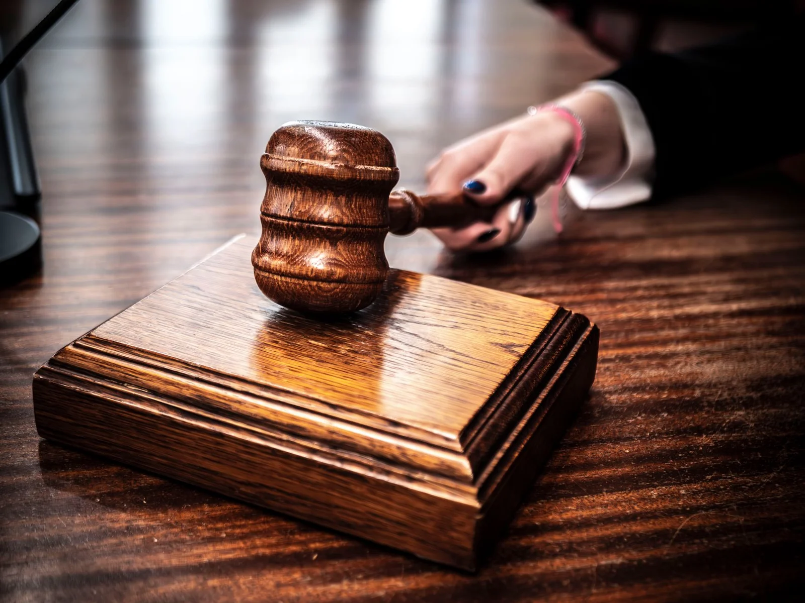 order xli rule 33 land acquisition - Close-up of a wooden gavel on a judge's desk, symbolizing justice.