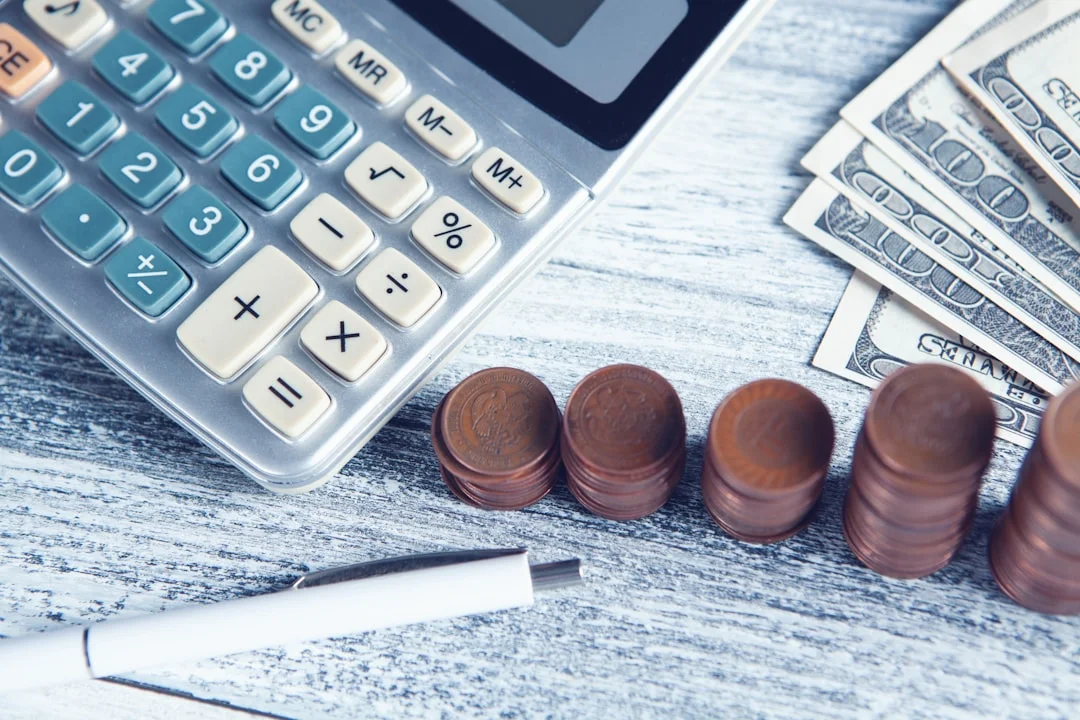 Supreme Court Clarifies That Corporate Guarantees - A calculator, pen, and money on a table