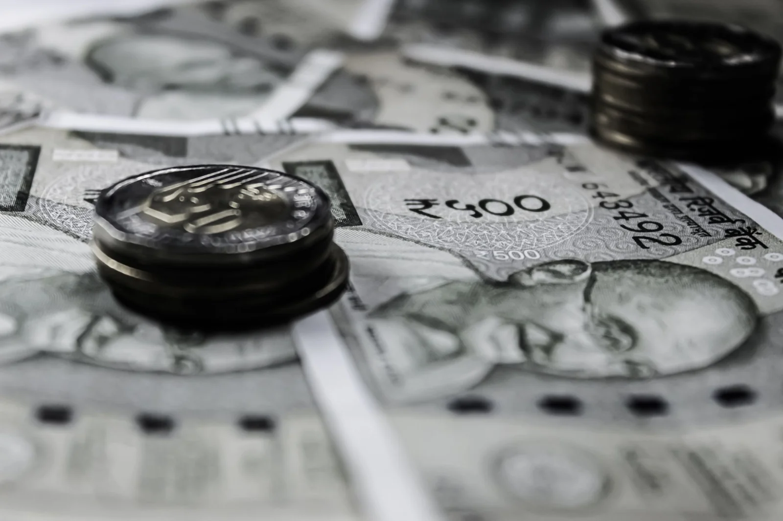 The Return of the FCCB: India’s - A detailed close-up of Indian currency notes and coins, highlighting financial themes.